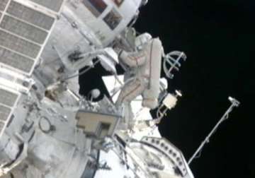 astronauts go spacewalking to hang station shields