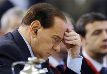 berlusconi in rare appearance at fraud case hearing