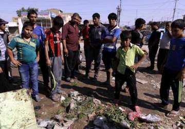 bomb blasts house raids in iraq leave 31 dead