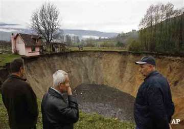 bosnians panic as sinkhole swallows village pond