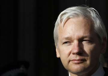 britain warns ecuador over giving asylum to julian assange