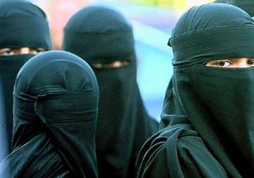 burqa clad women should show face when asked to witness their signature says australian body