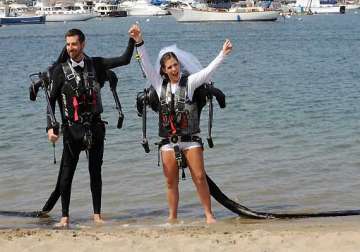 californian couple marry in air wearing jetpacks