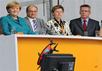 camera drone makes rough landing 2 metres from angela merkel