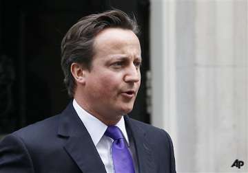 cameron defends actions but offers regret in hacking scandal