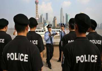 china arrests british american investigators