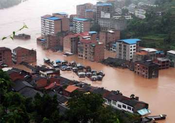 china flood deaths rise to 57 thousands evacuated