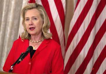 clinton urges world support for interim libyan authority