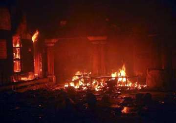 curfew in larkana muslim mobs set fire to hindu temple dharmashala shops