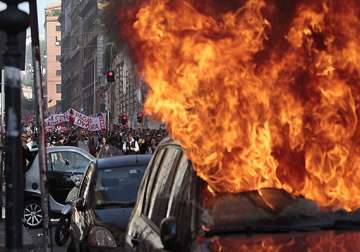 cars set on fire in rome worldwide protests against capitalism