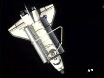 discovery undocks from iss for the last time
