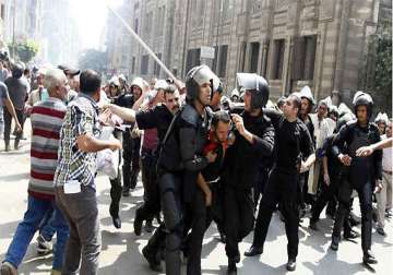 egyptian riot police fire tear gas at protesters