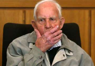 former nazi ss officer faces murder trial