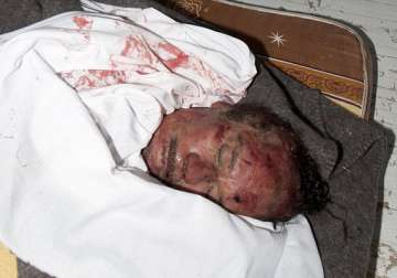 gaddafi son mutassim buried in unmarked desert graves son saif fleeing across desert