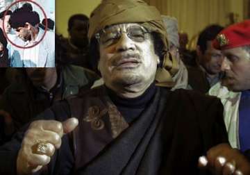 gaddafi s spymaster taken seif to be tried in libya