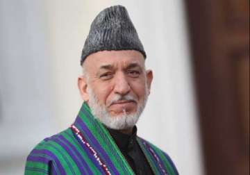 hamid karzai casts vote in presidential runoff polls