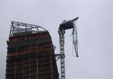 hurricane sandy leaves crane dangling over new york city