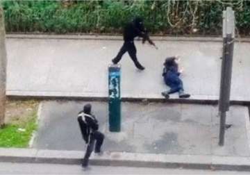 charlie hebdo attack cop killed on pavement identified as ahmed merabet