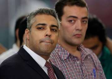 two al jazeera journalists walk free after pardon in egypt