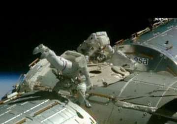 nasa astronauts finish spacewalk trilogy for space taxis