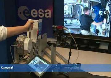 astronaut makes history by shaking hands with scientist 8 046 kms away on earth video