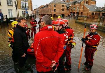david cameron heckled while touring flood hit northern region in uk