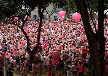 photo essay thousands take part in singapore s annual gay rights pink dot rally