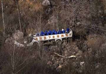 bus carrying china opera troupe falls off cliff killing 20