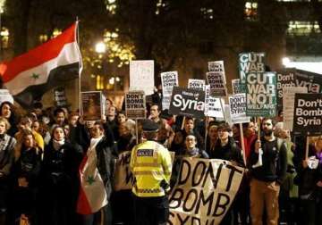 british parliament authorises airstrikes against isis amid anti war protests