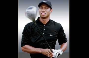 tiger woods to return to golf next month