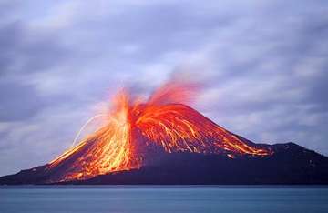 indonesian volcano spews ash lava