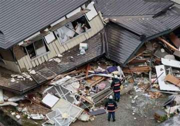 dozens take refuge from japan quake aftershocks