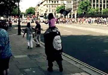 man girl spotted parading outside uk parliament with is flag
