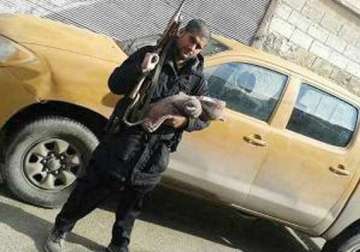 indian origin isis member poses with his newborn baby and ak 47 on twitter