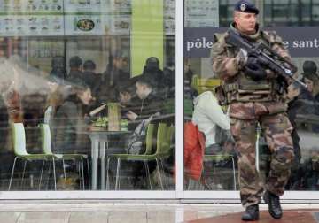 brussels schools reopen manhunt ongoing for paris suspects
