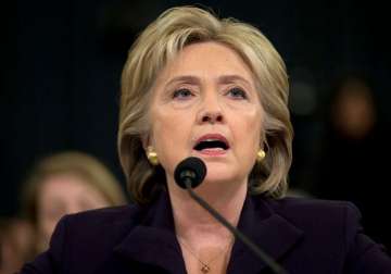 hillary clinton defends herself on benghazi as gop probes her record