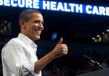 victorious obama says healthcare law here to stay