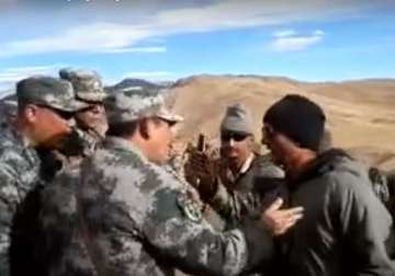 china plays down indian border standoff watch video