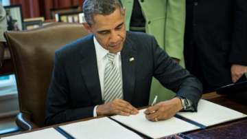 barack obama signs usd 1.1 trillion spending bill into law