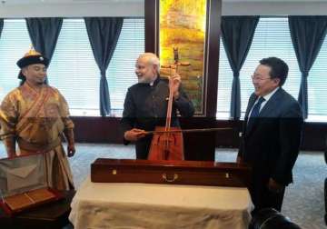 pm modi plays mongolian fiddle strikes new chord in ties