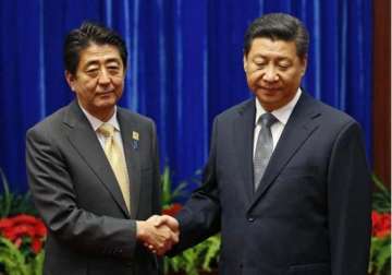 xi abe hold breakthrough meeting to end spat