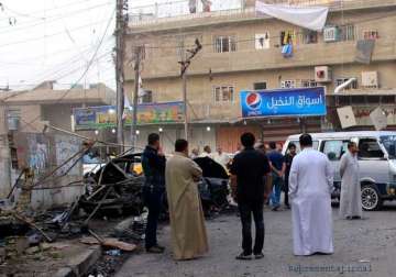 iraq caf blasts kill 20 is claims responsibility