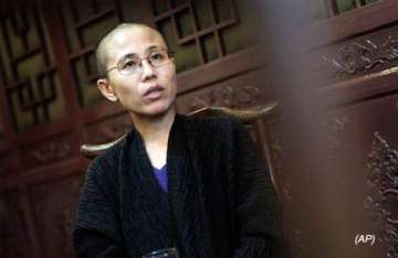 nobel laureate s wife forced to leave beijing