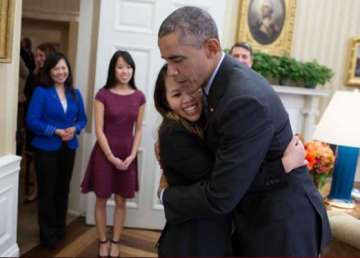barack obama hugs nurse who survived ebola