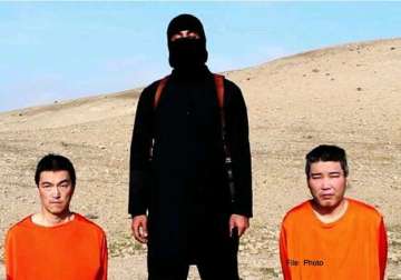 japan condemns new video not yet verifying it s of hostages