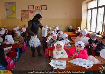 in an is training camp children told behead the doll
