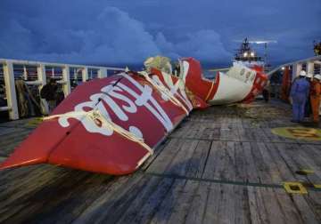 tail of airasia plane arrives at port airbus investigators inspect wreckage