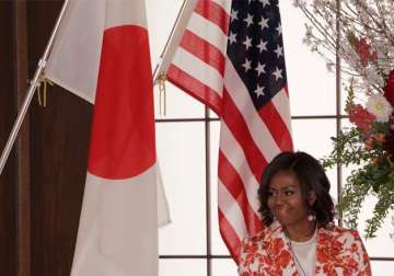 michelle obama visits japan to showcase girls education aid