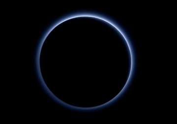 blue sky and red ice at pluto nasa spacecraft discovers