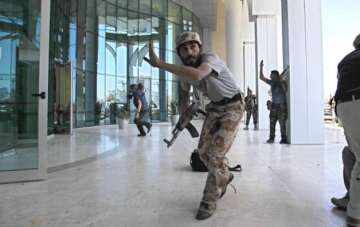 gunmen at libyan luxury hotel take hostages 3 guards dead